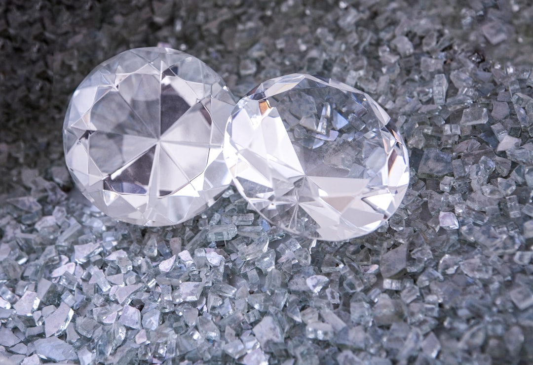 Two Diamonds are placed on a sea of pieces of glass.
